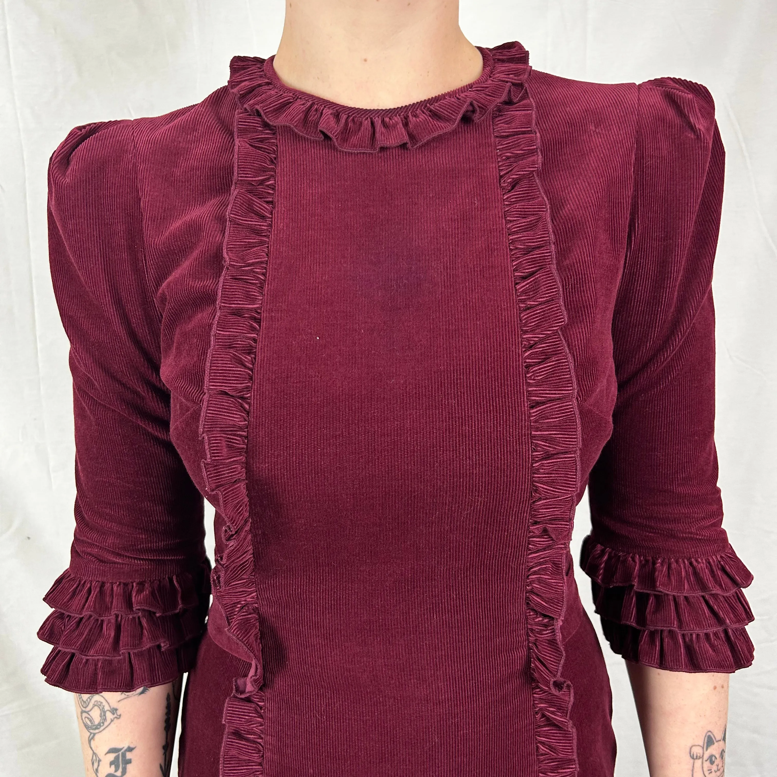 Here’s an optimized title for the e-commerce product:

The Vampires Wife Burgundy Needlecord Maxi Dress - Size Small, Elegant Vintage Style